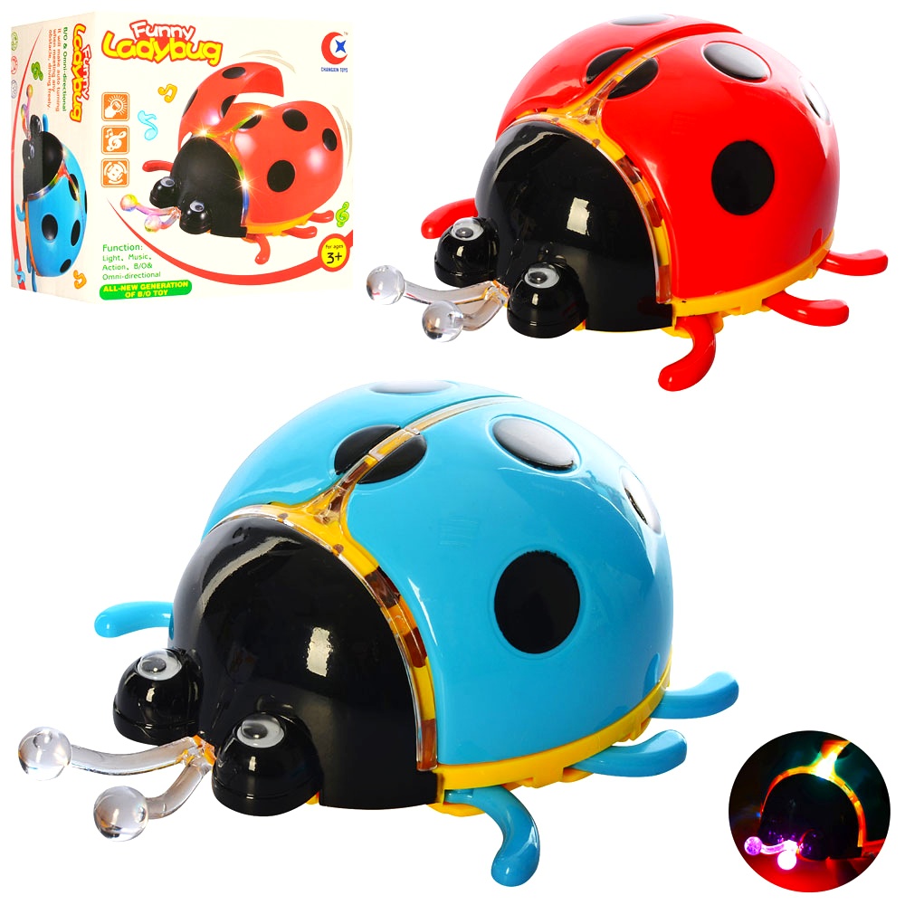 Іграшка музична «Божа корівка» 061 A , 13 см, музика, світло, їздить, рухливі крила , коробка